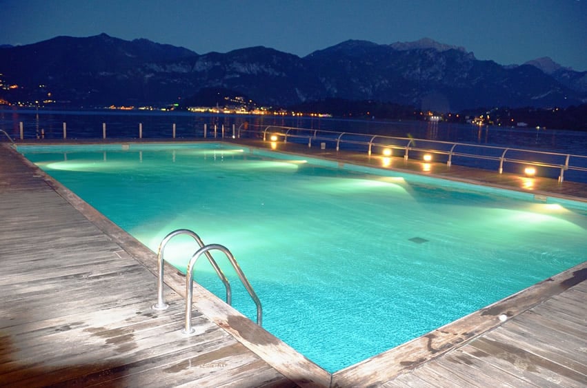 Swimming pool with mountain view and untreated wood decking