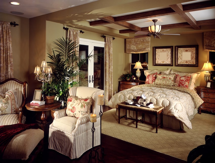 Traditional bedroom design with exposed beams and hardwood floors