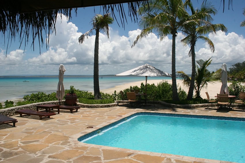 Tropical ocean front pool with sandy stone pattern
