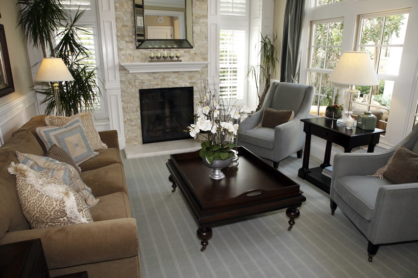 Room with lampshade, flower vases and candelabra on the mantel