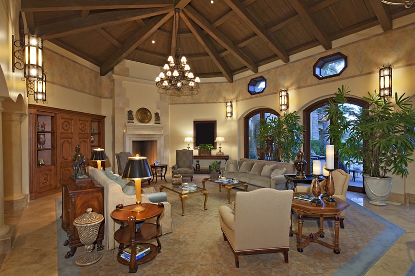 Well furnished living room with vaulted exposed beam ceiling