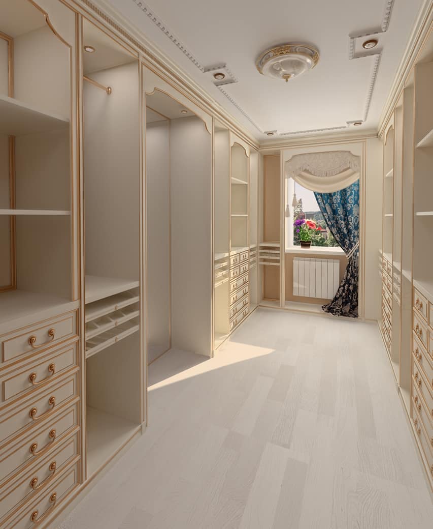Beautiful cream color walk in closet with chest of drawers