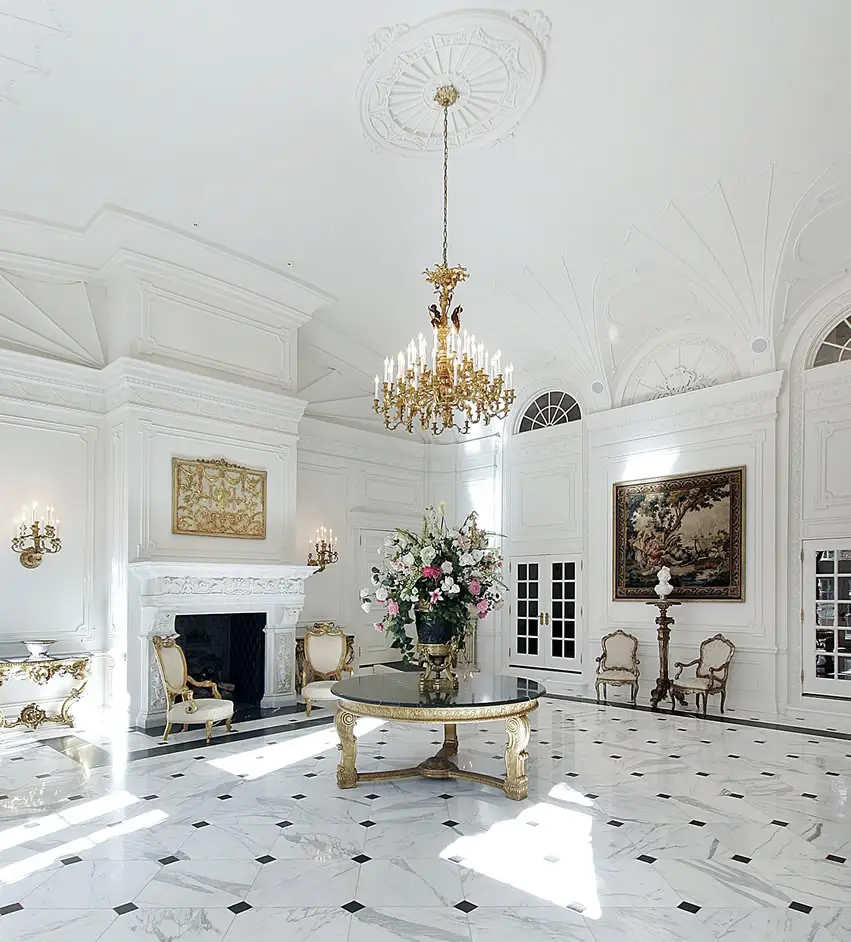 Entryway to mansion home with gold chandelier