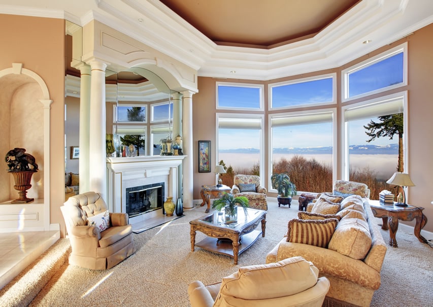 Beautiful living room with pillar fireplace and mountain view