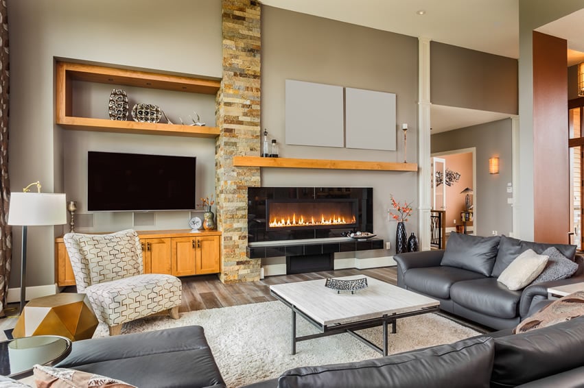 Casual living room with large leather sofa and fireplace