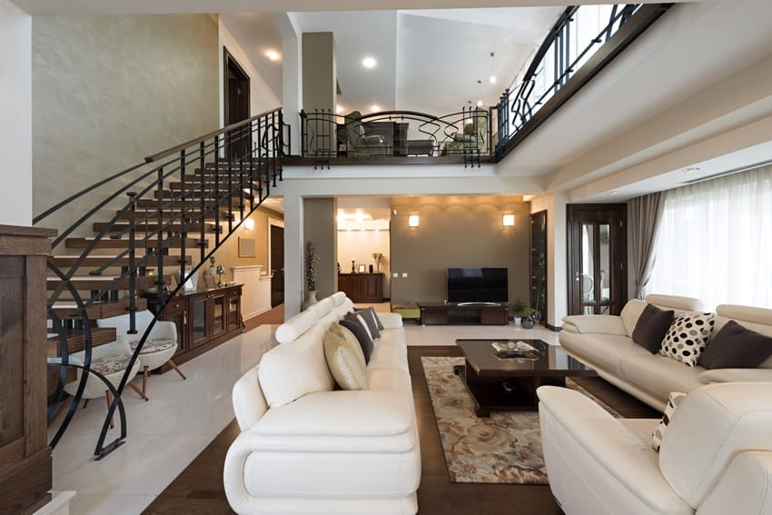 Classy living room with staircase and white & brown theme