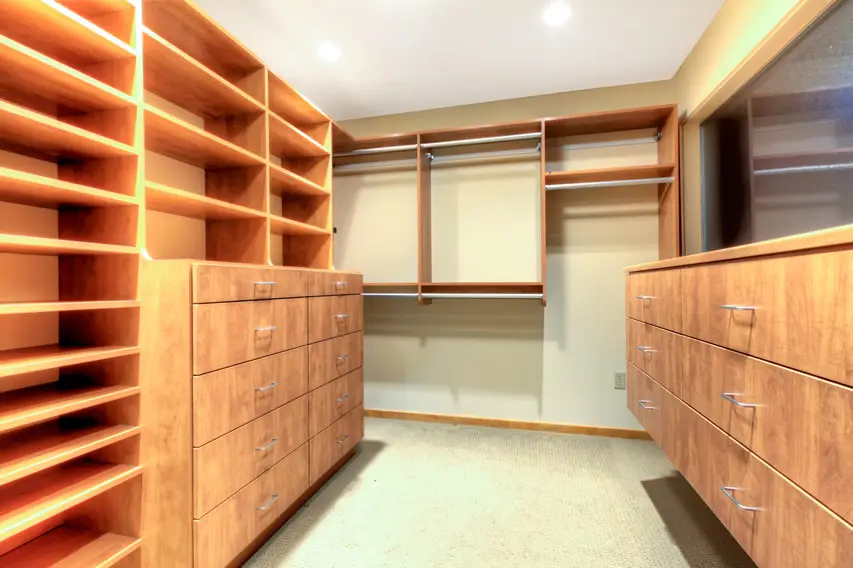 Contemporary closet design with wood accent