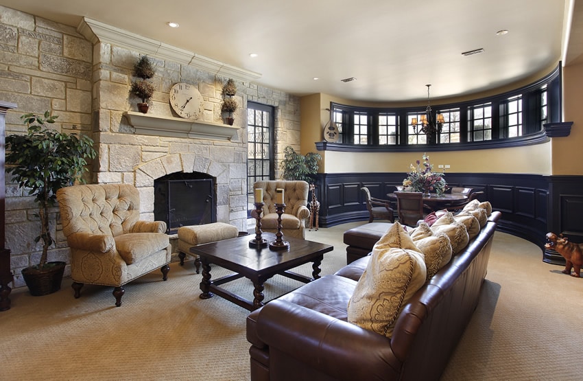 Custom designed living room with large fireplace and circular window area