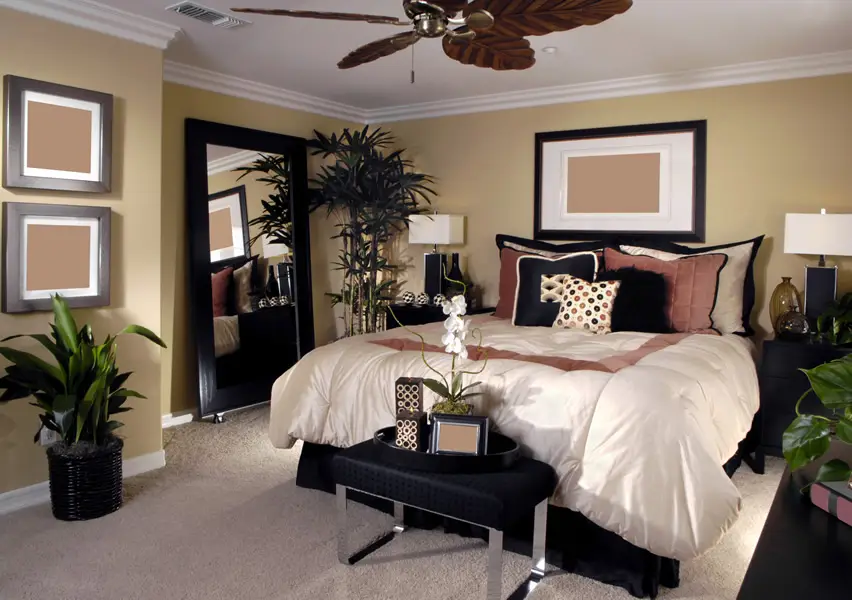 Leaf-style ceiling fan, panel wall art and white comforter