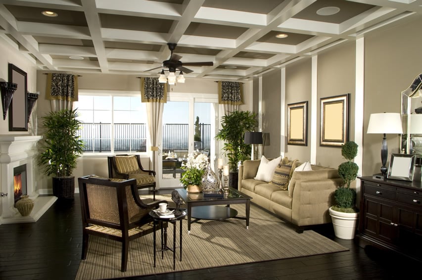 Coffered ceiling, dark wood console table and beige sofa