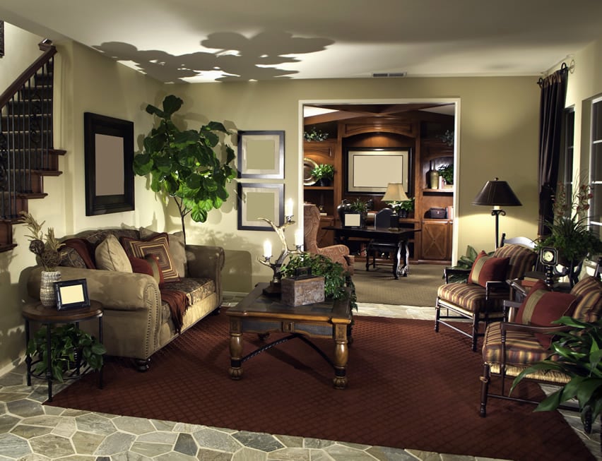 Room with carpet, table, picture frames and doorway