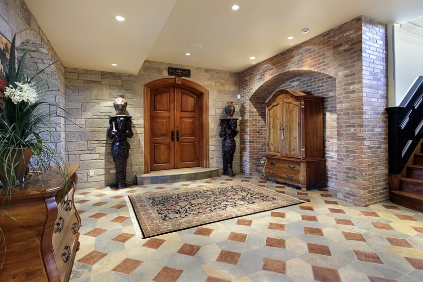 Grand entrance to upscale home with stone and brick walls