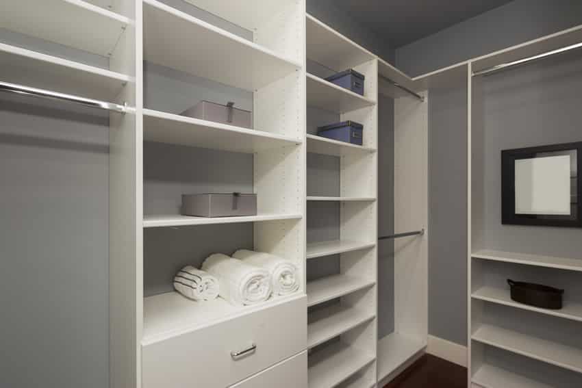 Gray and white walk in closet design
