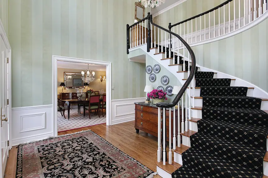 Foyer with carpet runner on stairs