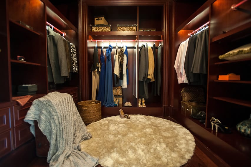 Custome cabinetry in a large walk-in wardrobe closet