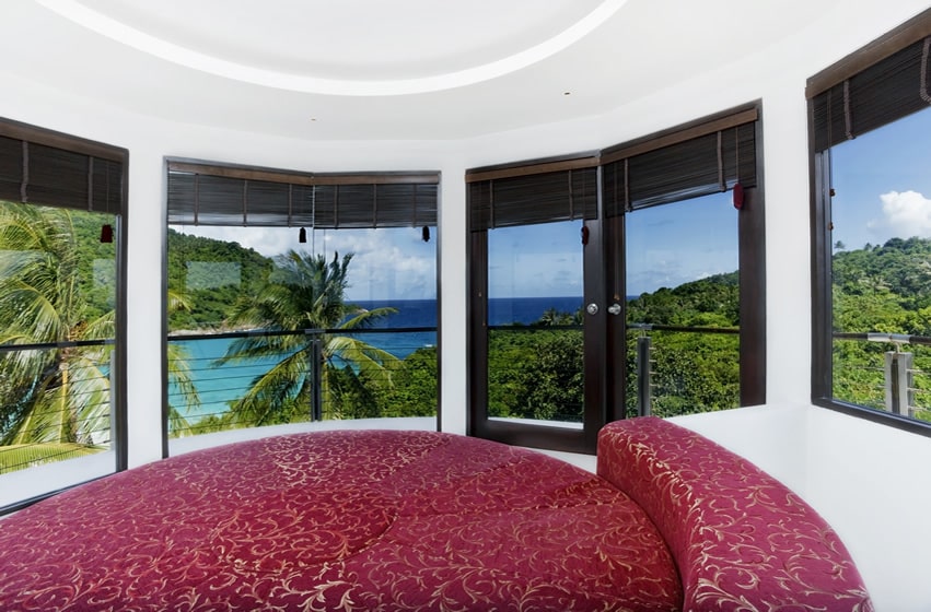 Round bedroom and bed with tropical ocean view