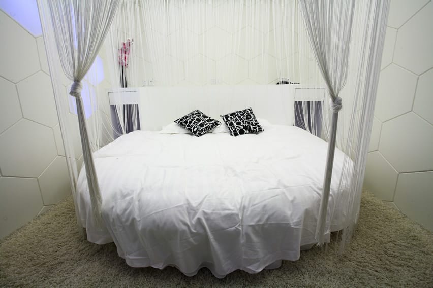 Round shape modern bed with sheer drapery
