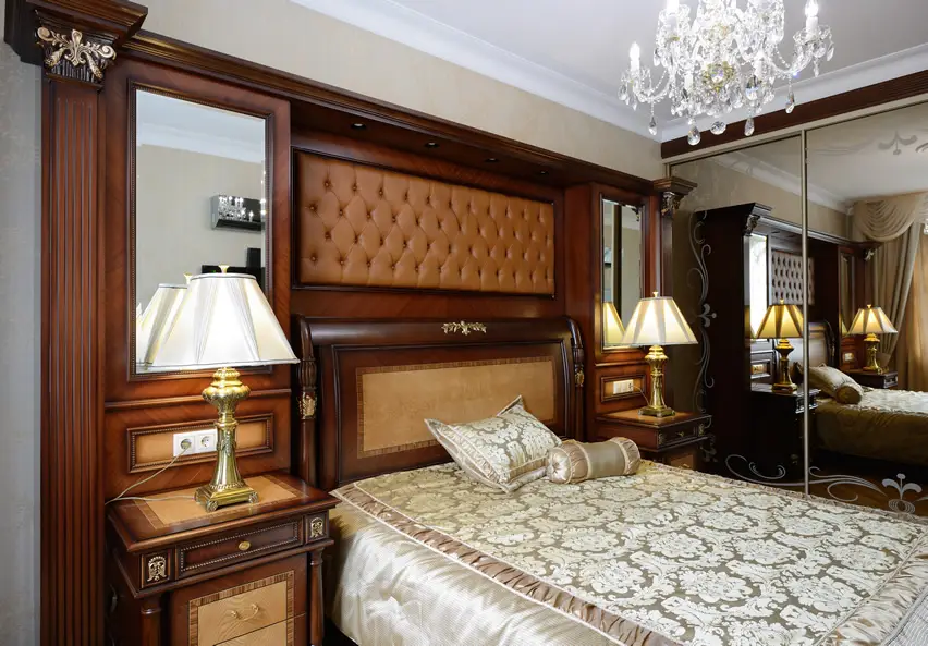 Neoclassical designed headboard, brocade bed cover and mirror wall