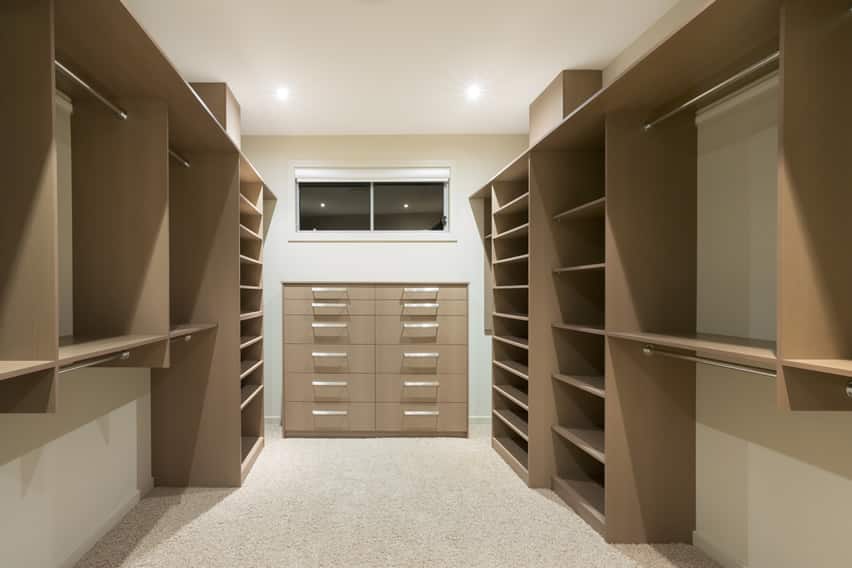 Beige closet with pin-mounted shelves