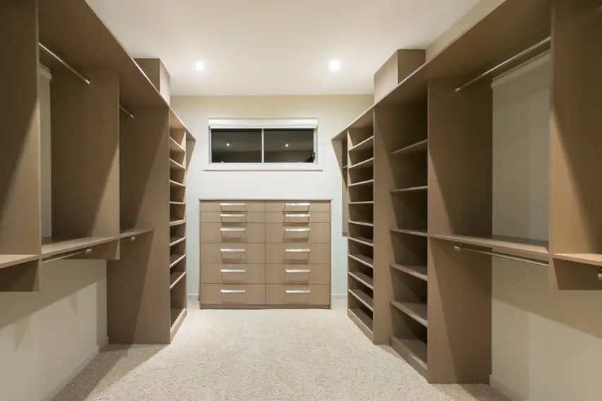 Beige closet with pin-mounted shelves