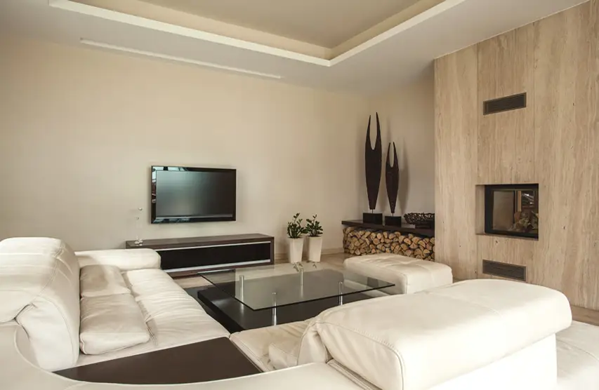 Room with upholstered leather bench, sofa and glass coffee table