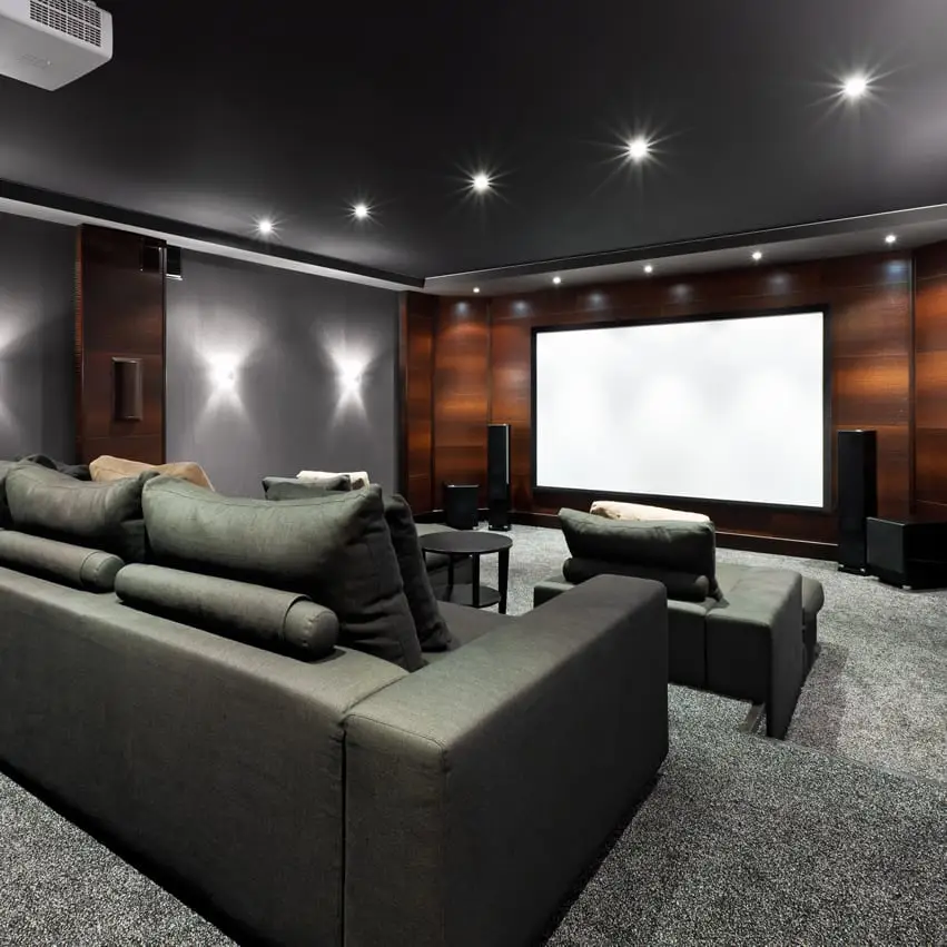 Black grey home theater with brown accent wall
