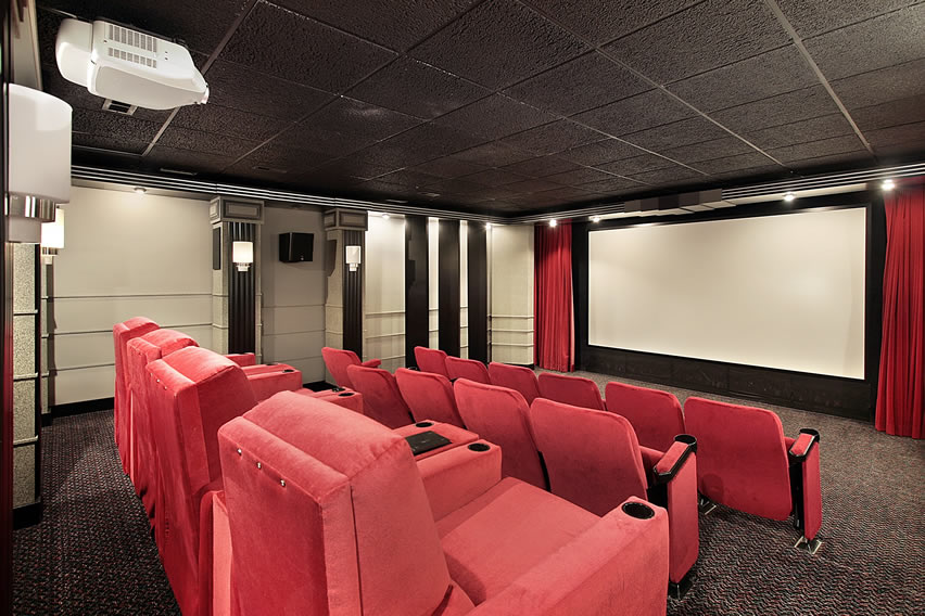 Home theater room with red cushion seats