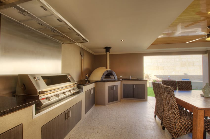 Large covered outdoor kitchen with oven