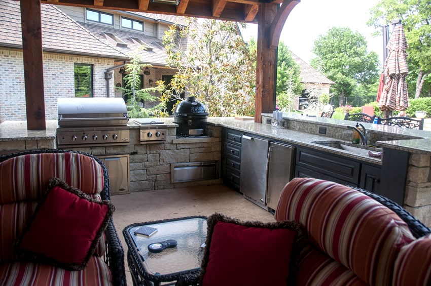 Luxury outdoor kitchen with sink in granite countertops