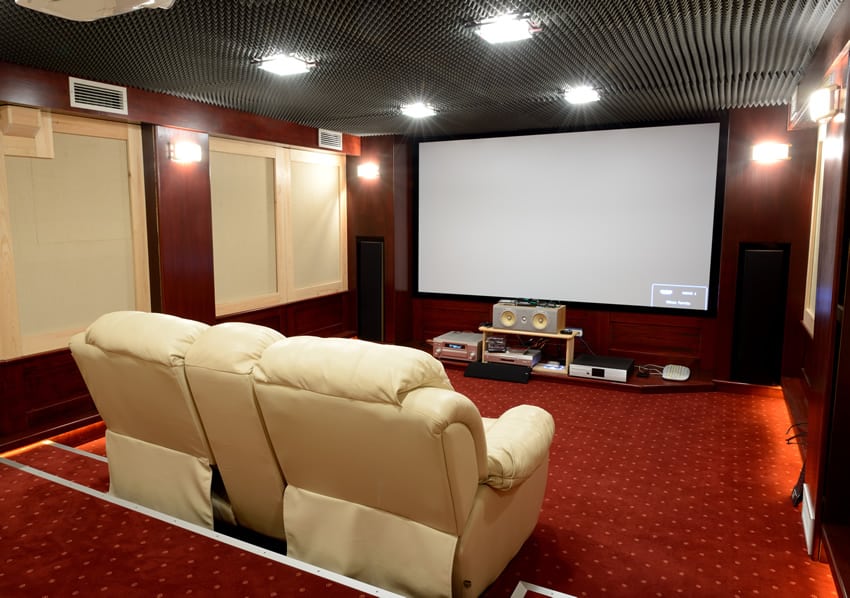 Movie room with white leather recliners