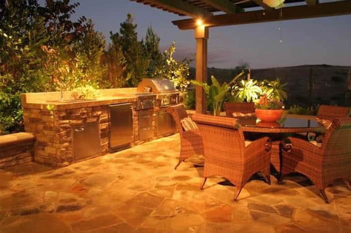 Kitchen inside a patio with outdoor dining set