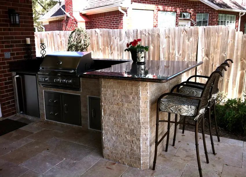 Patio with mini bar and two stools with upholstered seating