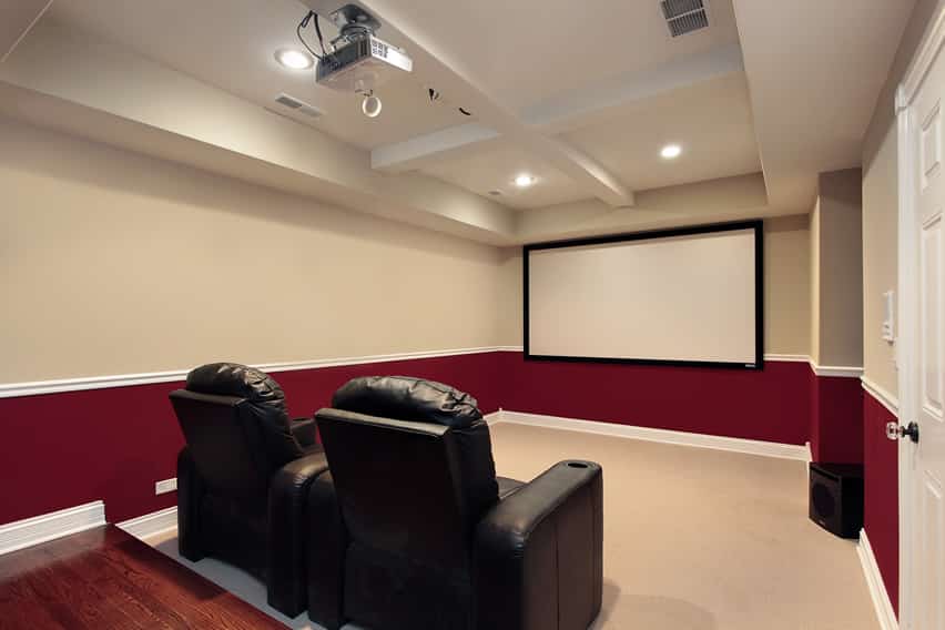 Red and white movie room with projector