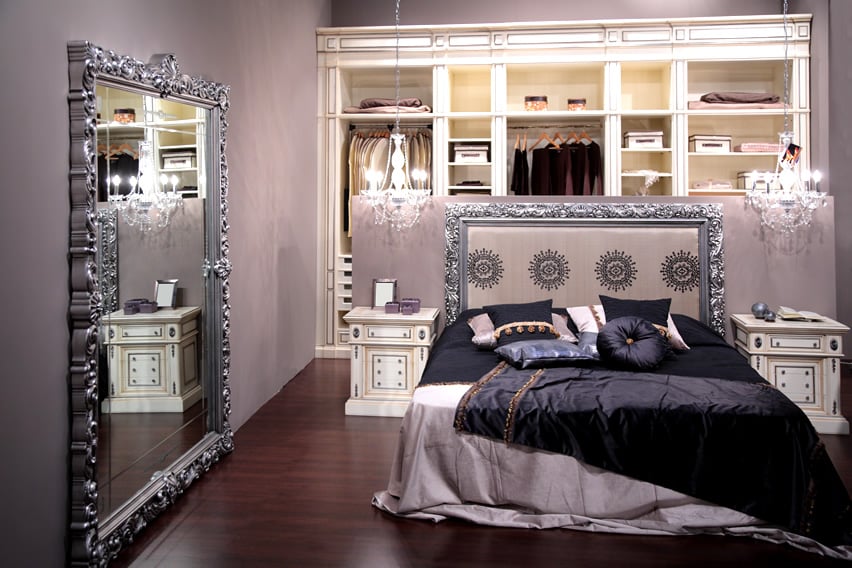 Small bedroom with large mirror