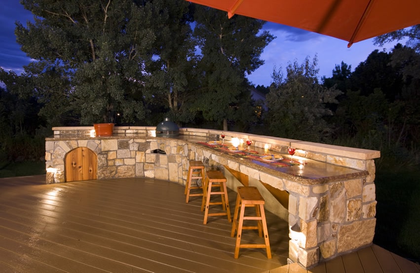 Stone dining area with rustic cooking area