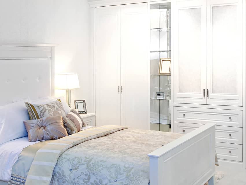 White bedroom wardrobe with glass shelves