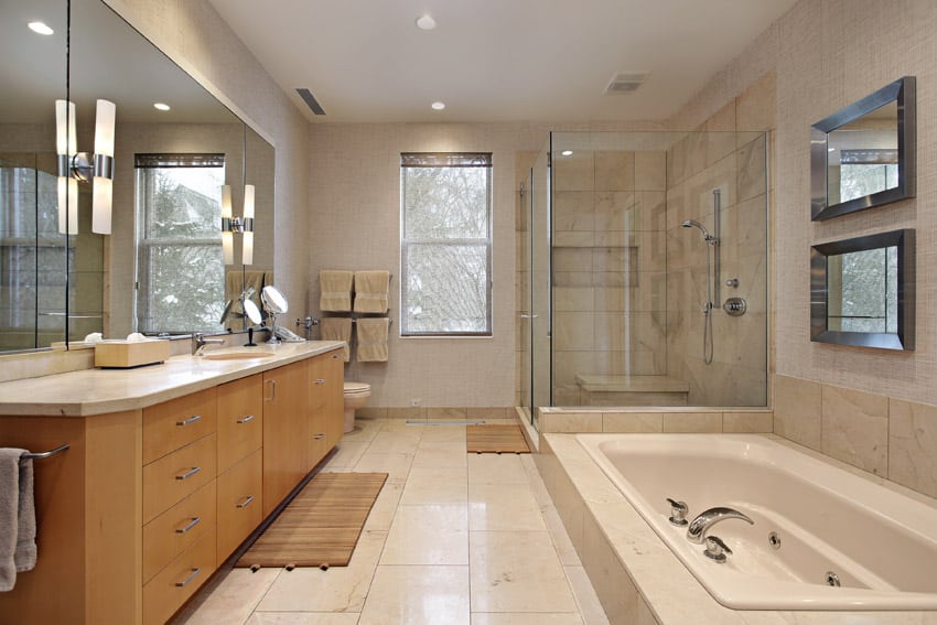 Master bath in luxury home with oak wood cabinetry