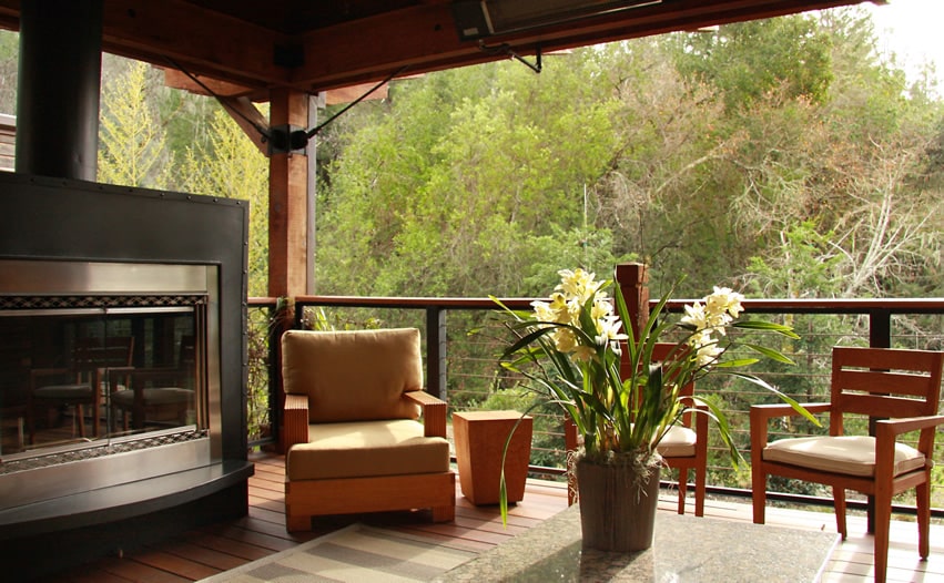 Black and silver outdoor fireplace on covered deck