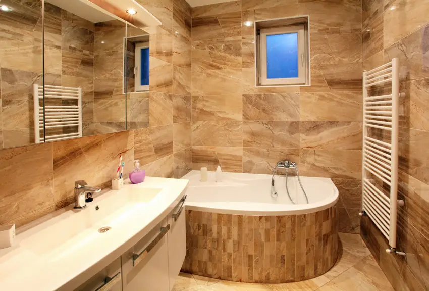 Bathroom with large rounded soaking tub and panel mirrors