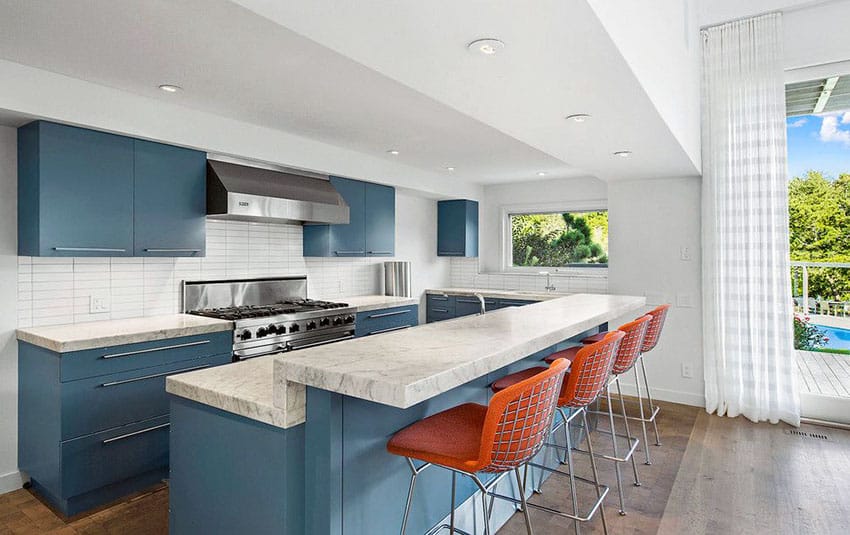 Contemporary kitchen with blue cabinets and carrara white marble countertops