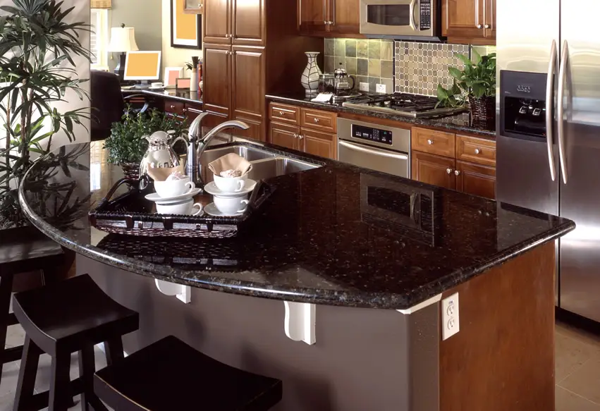 Dark granite countertop kitchen design