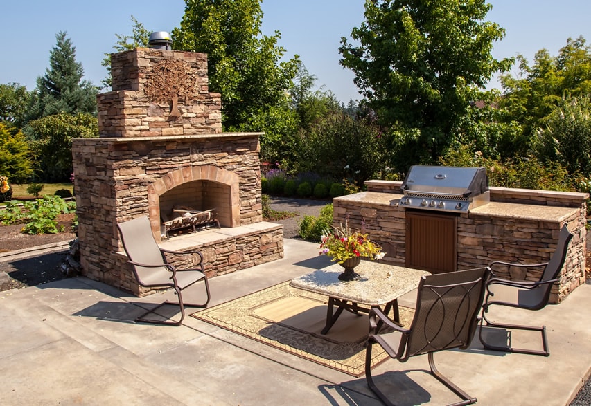 Large stone fireplace and outdoor kitchen