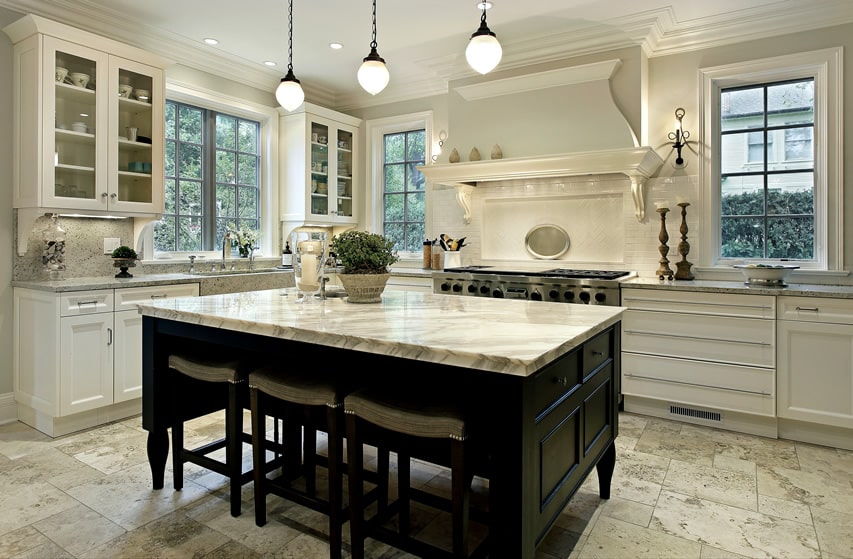 Large white kitchen with dark wood island