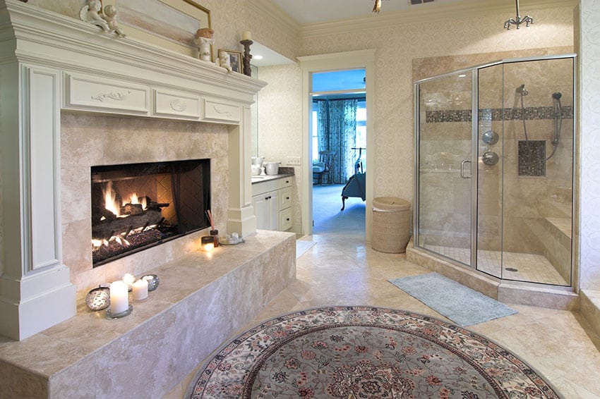 Bathroom suite with large fireplace and glass shower enclosure