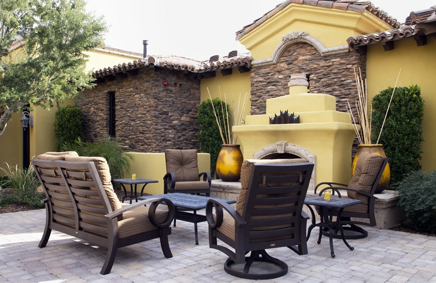Luxury outdoor fireplace sitting area in yellow