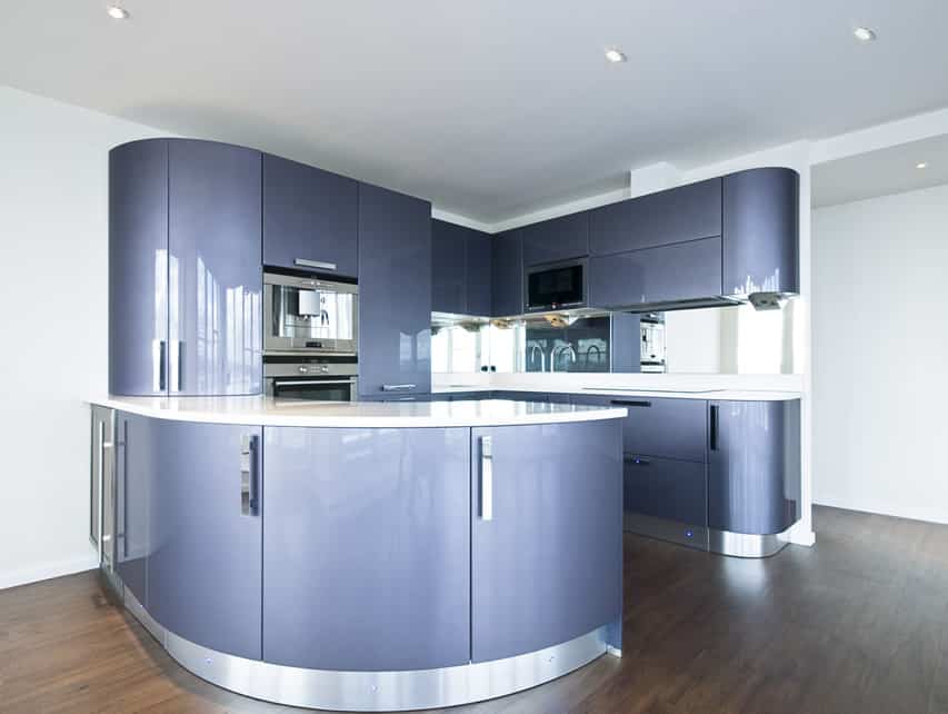 Ultra modern blue kitchen with curved counter top