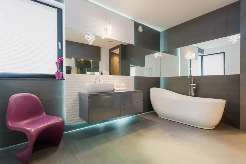 Bathroom with laminated flooring and purple accent chair