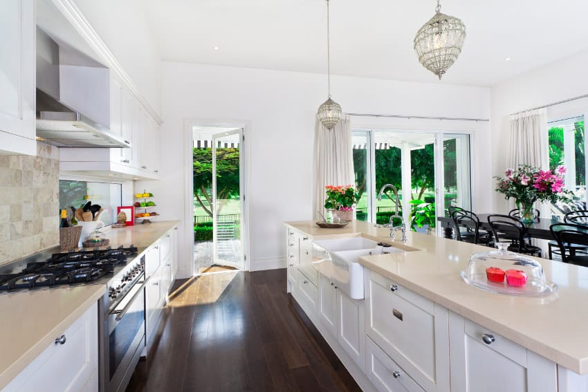 Stylish open plan kitchen with cream quartz counter