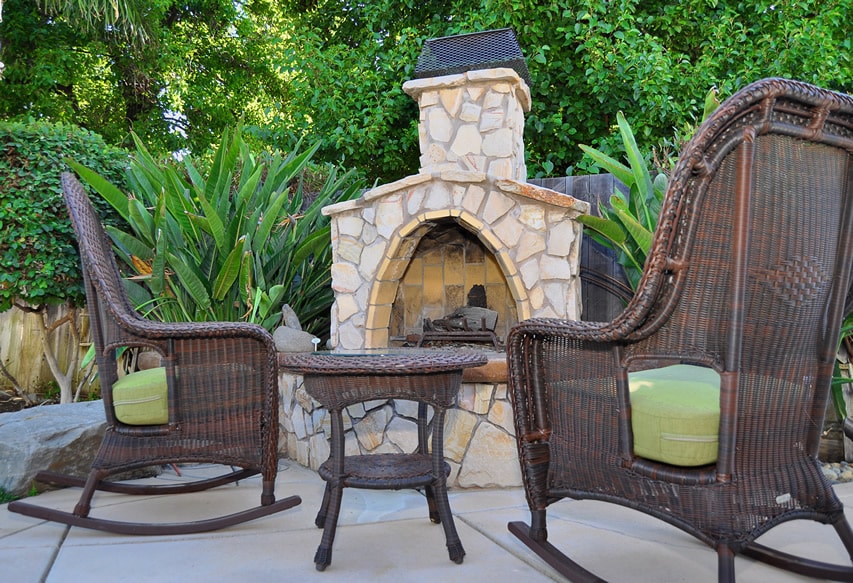 Rustic outdoor fireplace made from stone