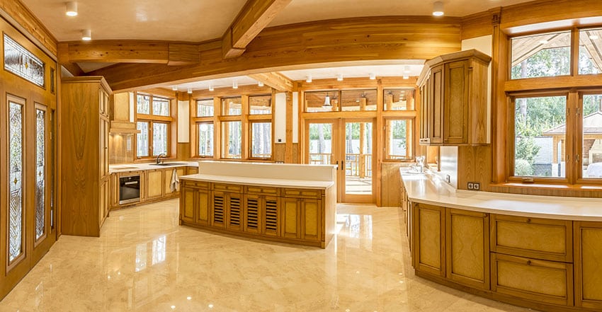 Spacious kitchen made of wood with island